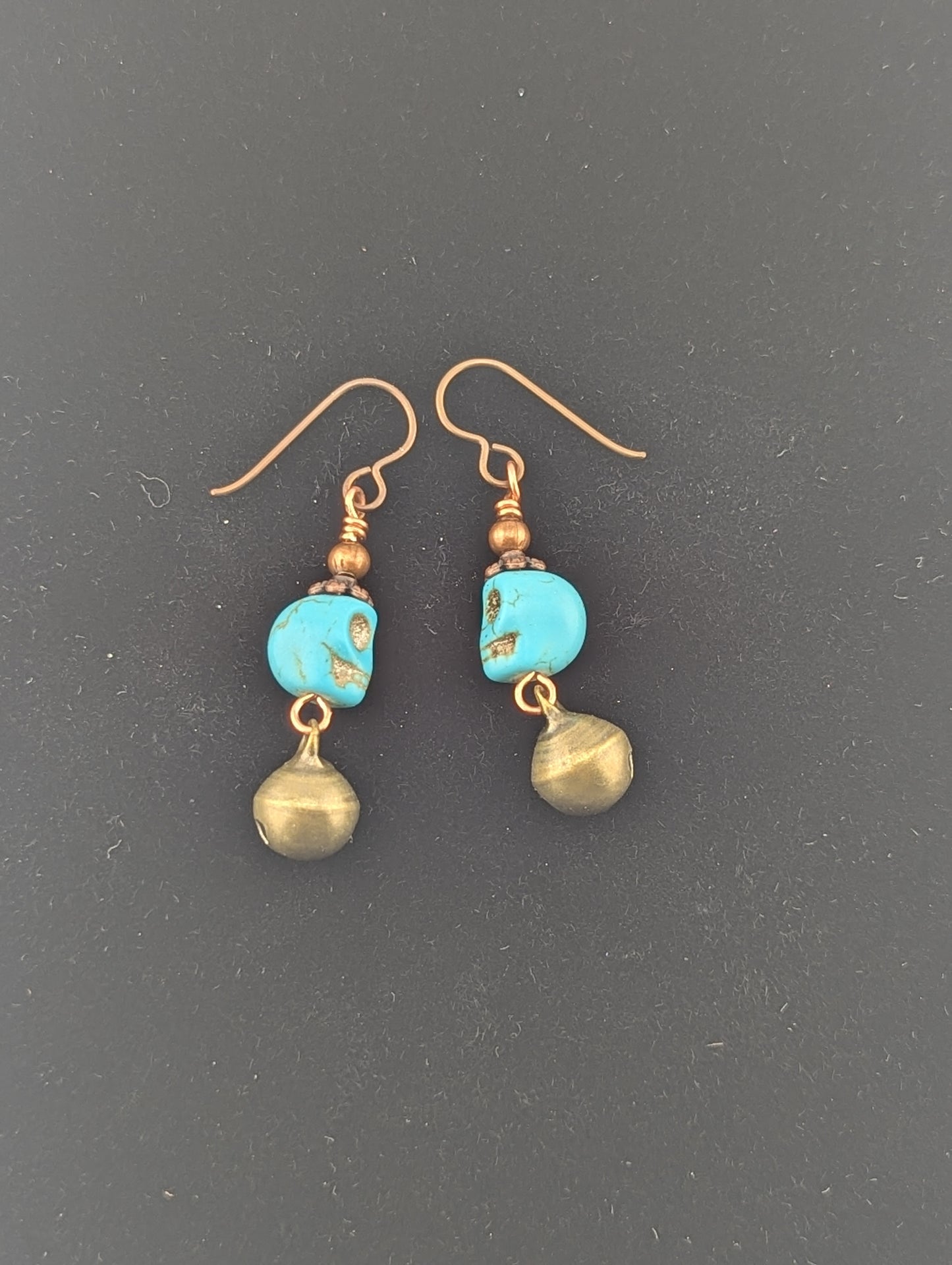 Skull earrings with a Jingle bell in antiqued Copper finish