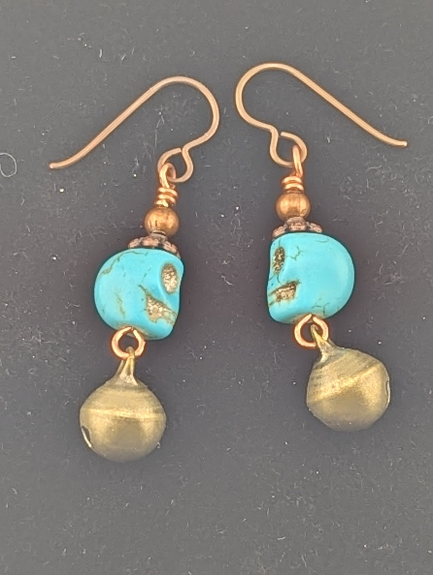 Skull earrings with a Jingle bell in antiqued Copper finish