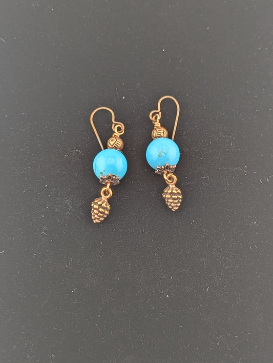 Turquoise earrings with a Pine Cone charm in antiqued Copper finish