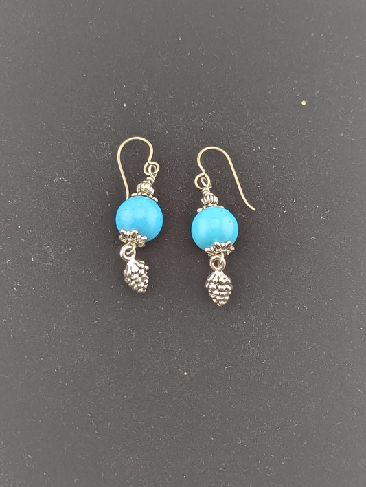 Turquoise earrings with a Pine Cone charm in antiqued Silver finish