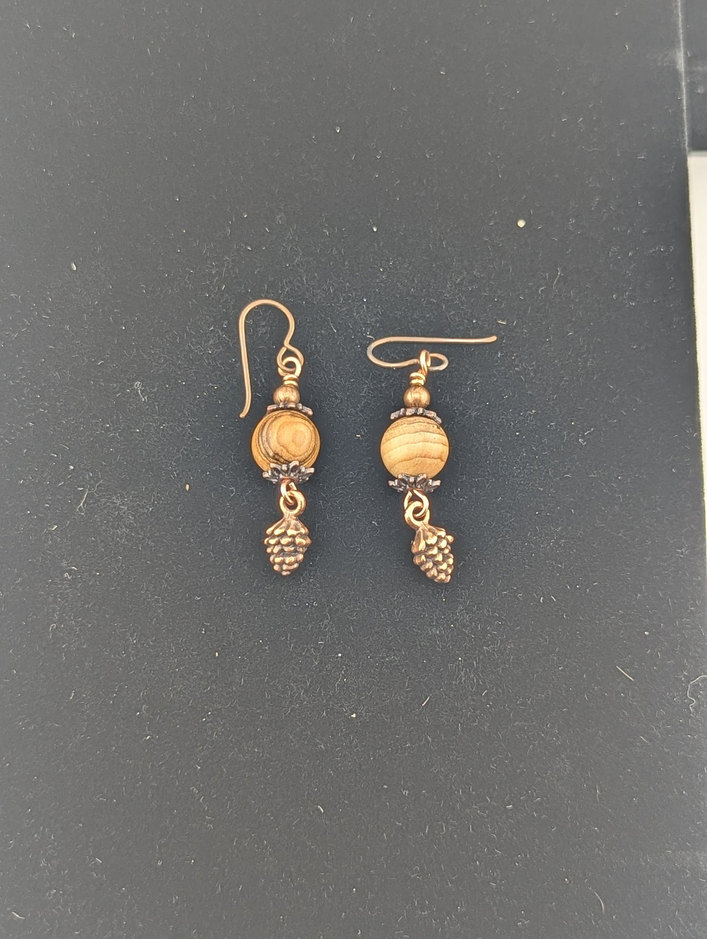 Wooden bead earrings with a Pine Cone charm in antiqued Copper finish