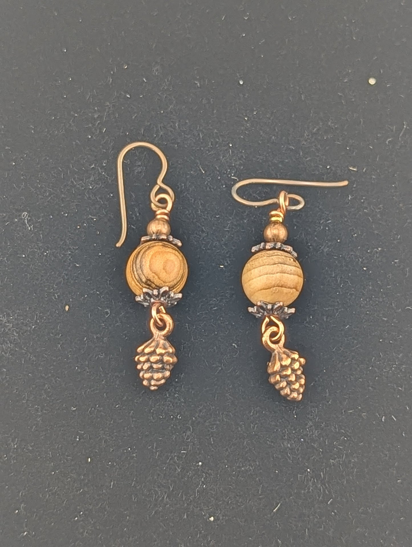 Wooden bead earrings with a Pine Cone charm in antiqued Copper finish