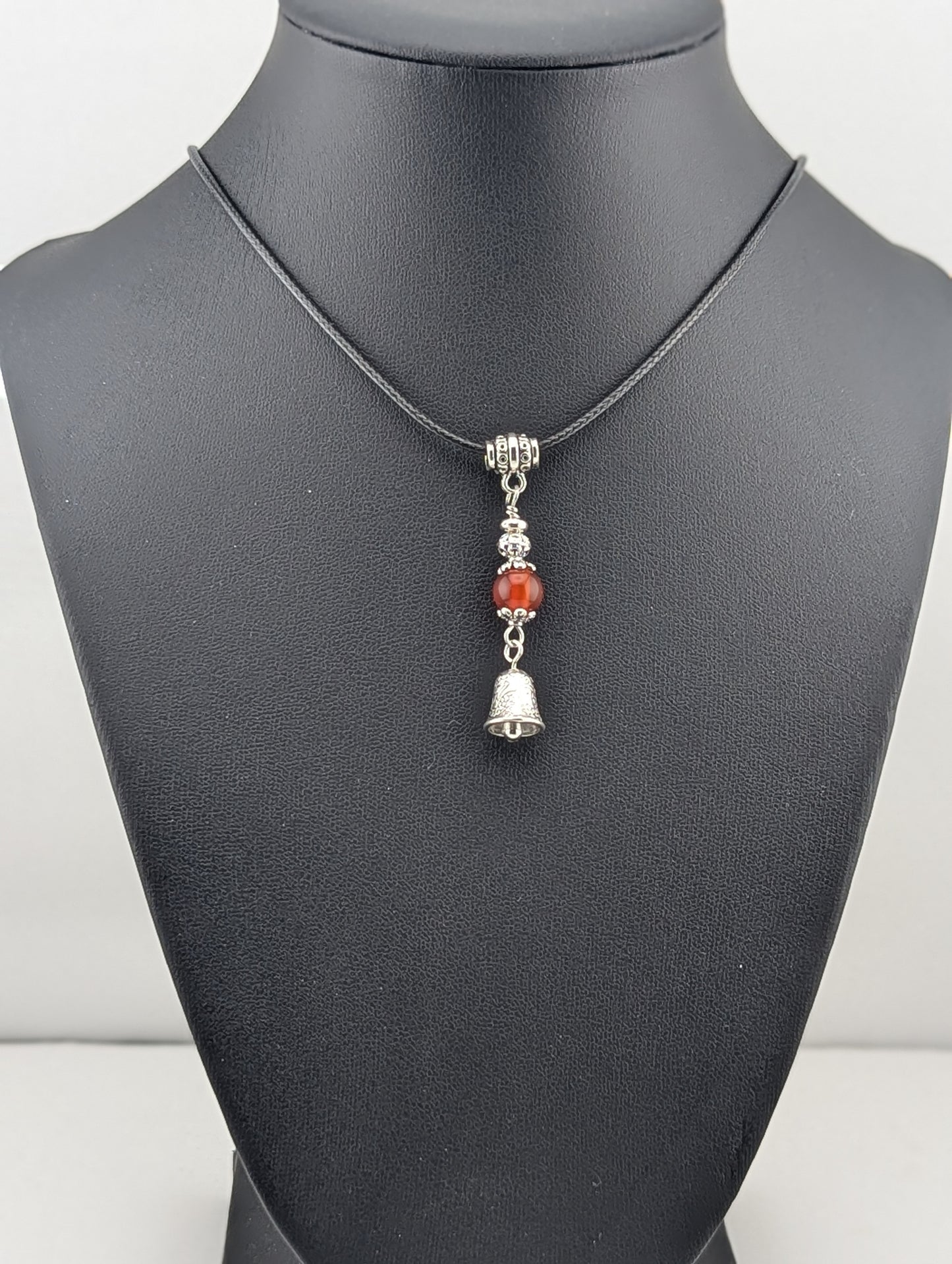 Carnelian pendant with a Silver Bell charm in antiqued Silver finish