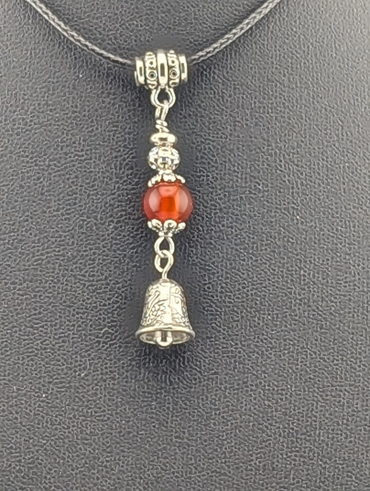 Carnelian pendant with a Silver Bell charm in antiqued Silver finish