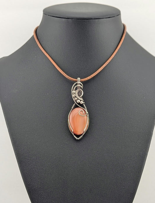 Carnelian gemstone Pendant, set in antiqued Silver.