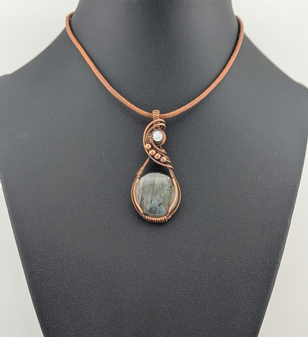 Labradorite gemstone pendant with Blue and Silver flash, accented with Moonstone and set in antiqued copper.