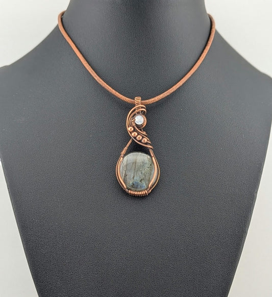 Labradorite gemstone pendant with Blue and Silver flash, accented with Moonstone and set in antiqued copper.