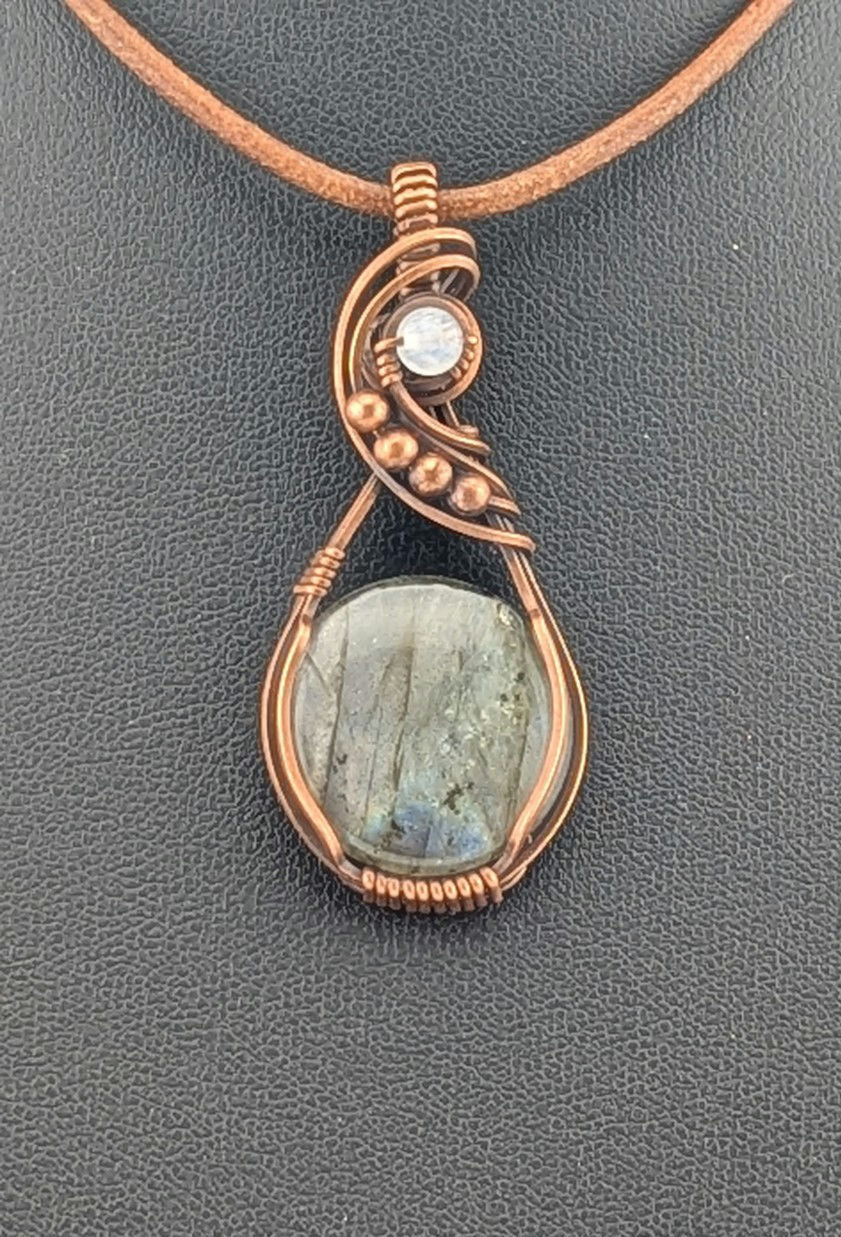 Labradorite gemstone pendant with Blue and Silver flash, accented with Moonstone and set in antiqued copper.