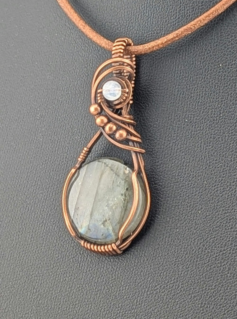 Labradorite gemstone pendant with Blue and Silver flash, accented with Moonstone and set in antiqued copper.