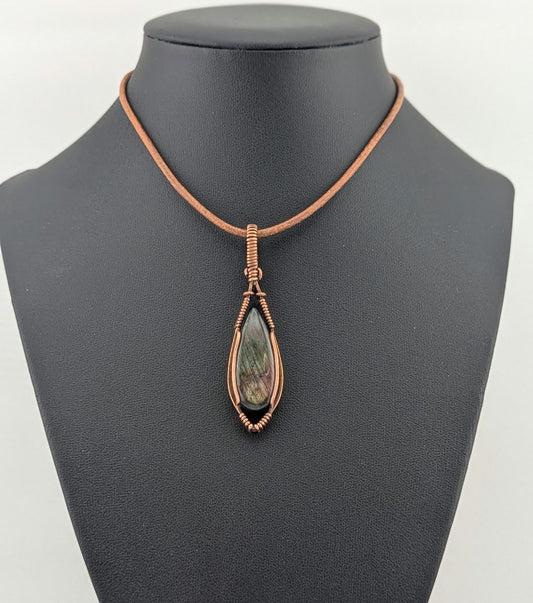 Labradorite pendant with purple and green flash, set in antiqued copper.