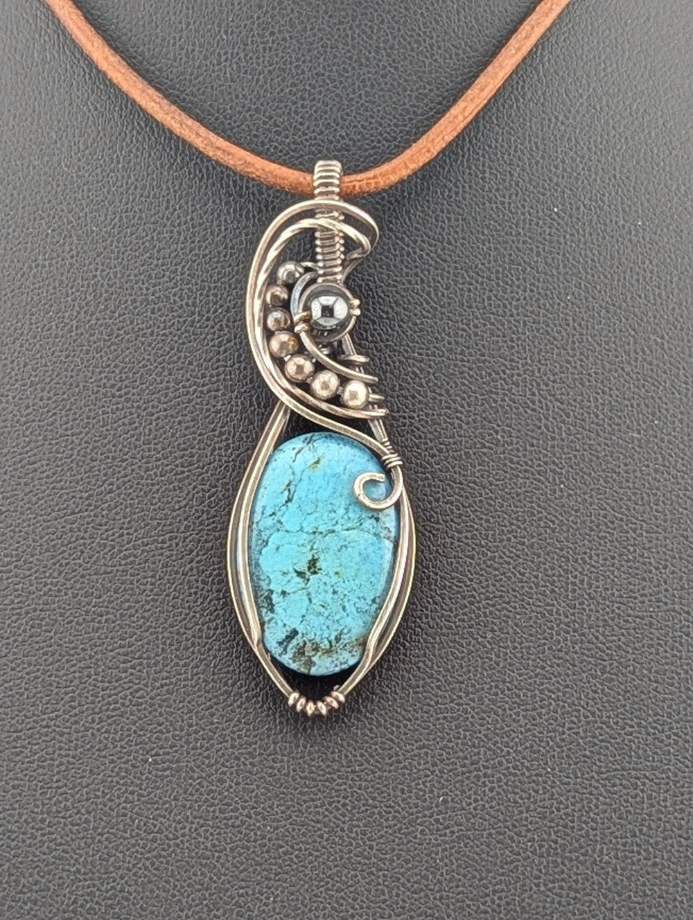 Kingman Turquoise pendant, accented with hematite and set in antiqued Silver.