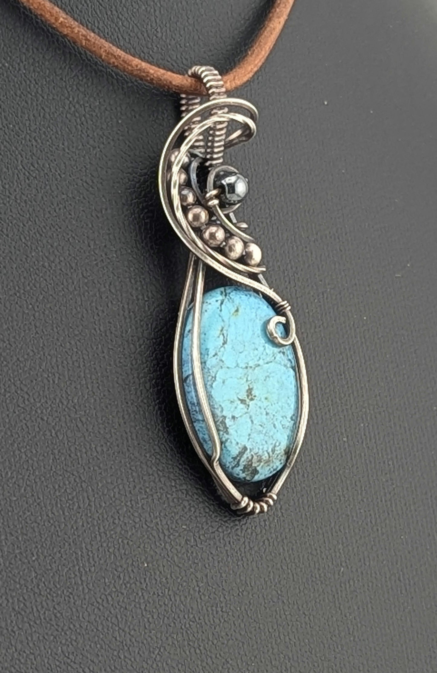 Kingman Turquoise pendant, accented with hematite and set in antiqued Silver.