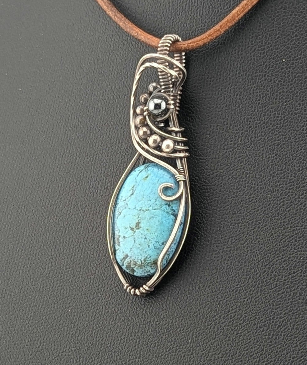 Kingman Turquoise pendant, accented with hematite and set in antiqued Silver.