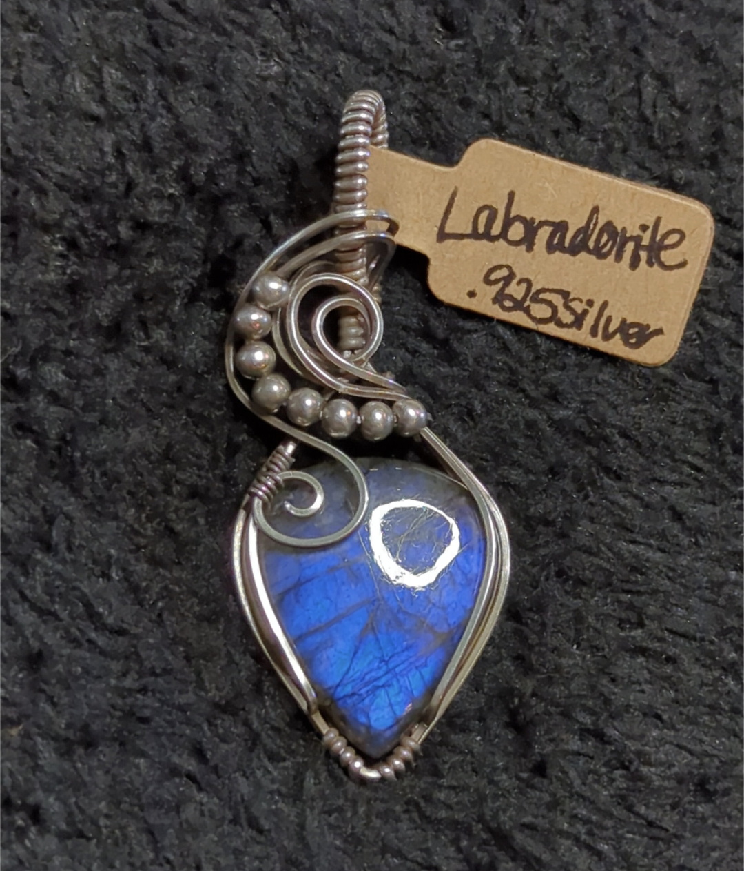 Labradorite pendant with blue flash, set in antiqued Sterling Silver.