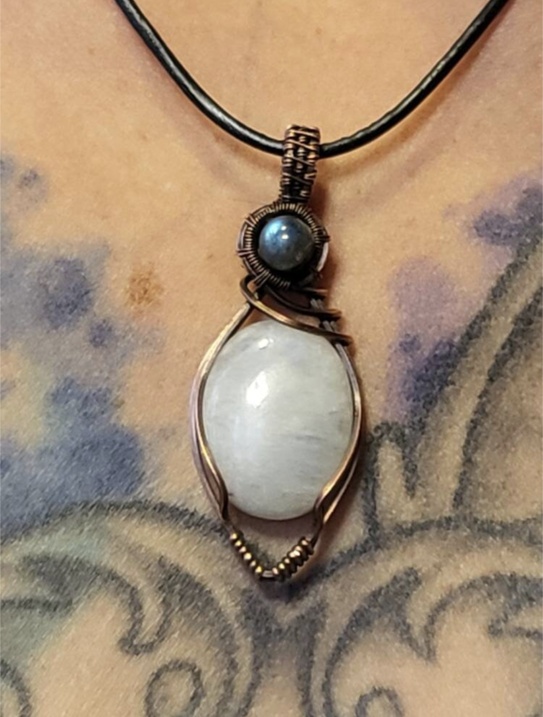 Moonstone pendant, accented with blue Labradorite, set in antiqued copper.