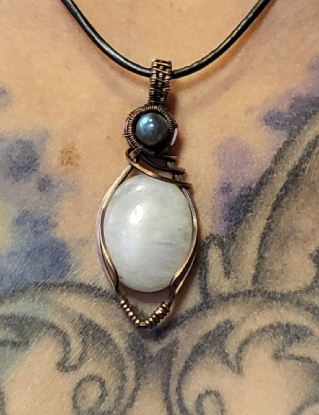 Moonstone pendant, accented with blue Labradorite, set in antiqued copper.