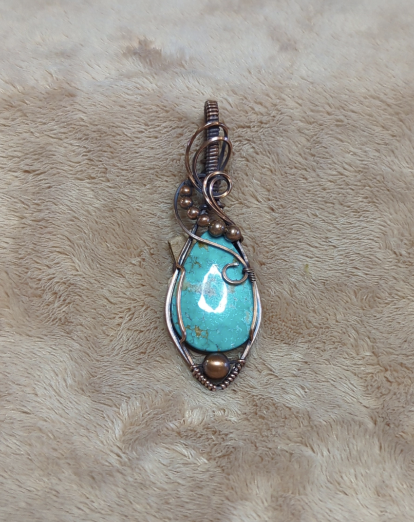 Kingman Turquoise pendant, accented with copper beads, set in antiqued copper.