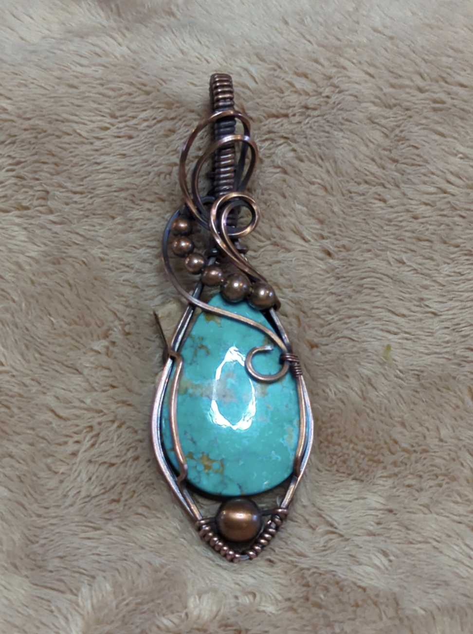 Kingman Turquoise pendant, accented with copper beads, set in antiqued copper.