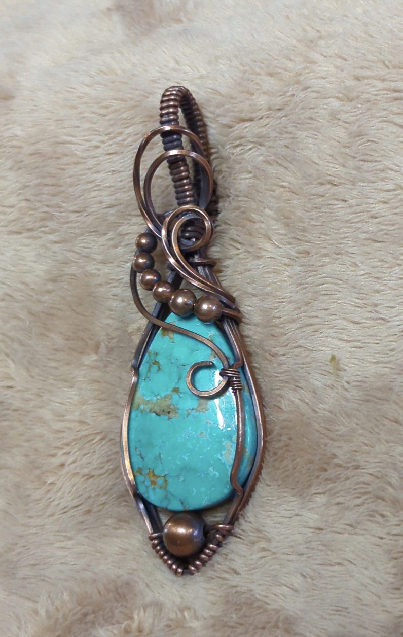 Kingman Turquoise pendant, accented with copper beads, set in antiqued copper.