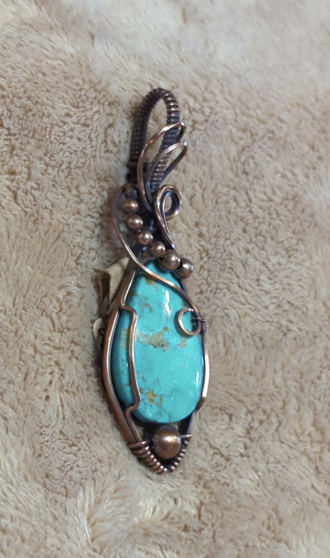 Kingman Turquoise pendant, accented with copper beads, set in antiqued copper.