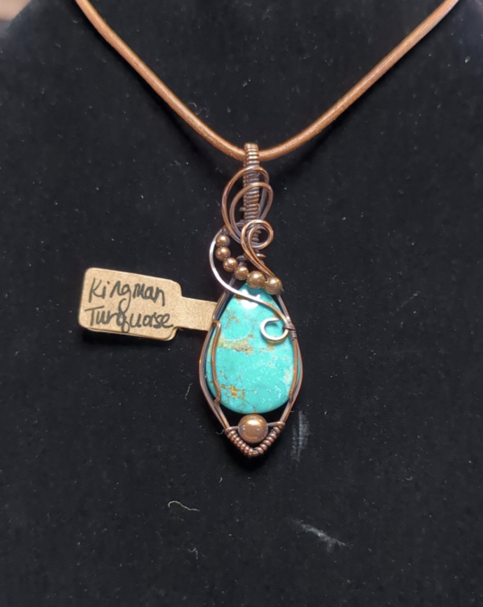 Kingman Turquoise pendant, accented with copper beads, set in antiqued copper.