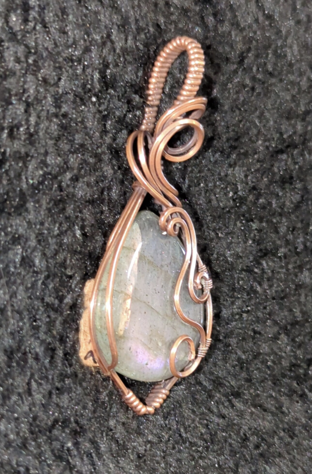 Labradorite pendant with blue and purple flash, set in antiqued copper.