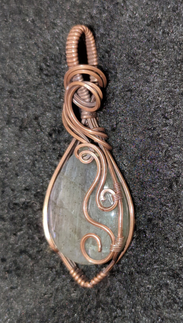 Labradorite pendant with blue and purple flash, set in antiqued copper.