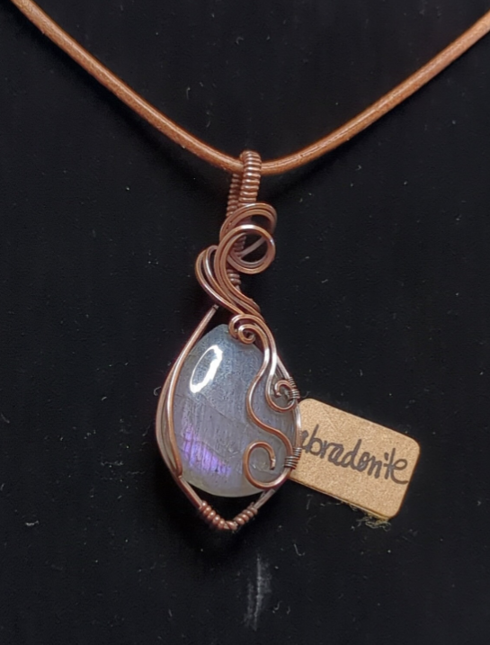 Labradorite pendant with blue and purple flash, set in antiqued copper.