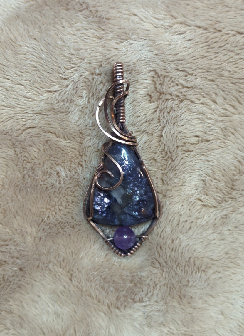 Iolite sunstone pendant, accented with Amethyst, set in antiqued copper.