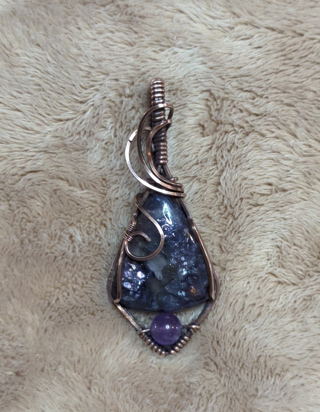 Iolite sunstone pendant, accented with Amethyst, set in antiqued copper.