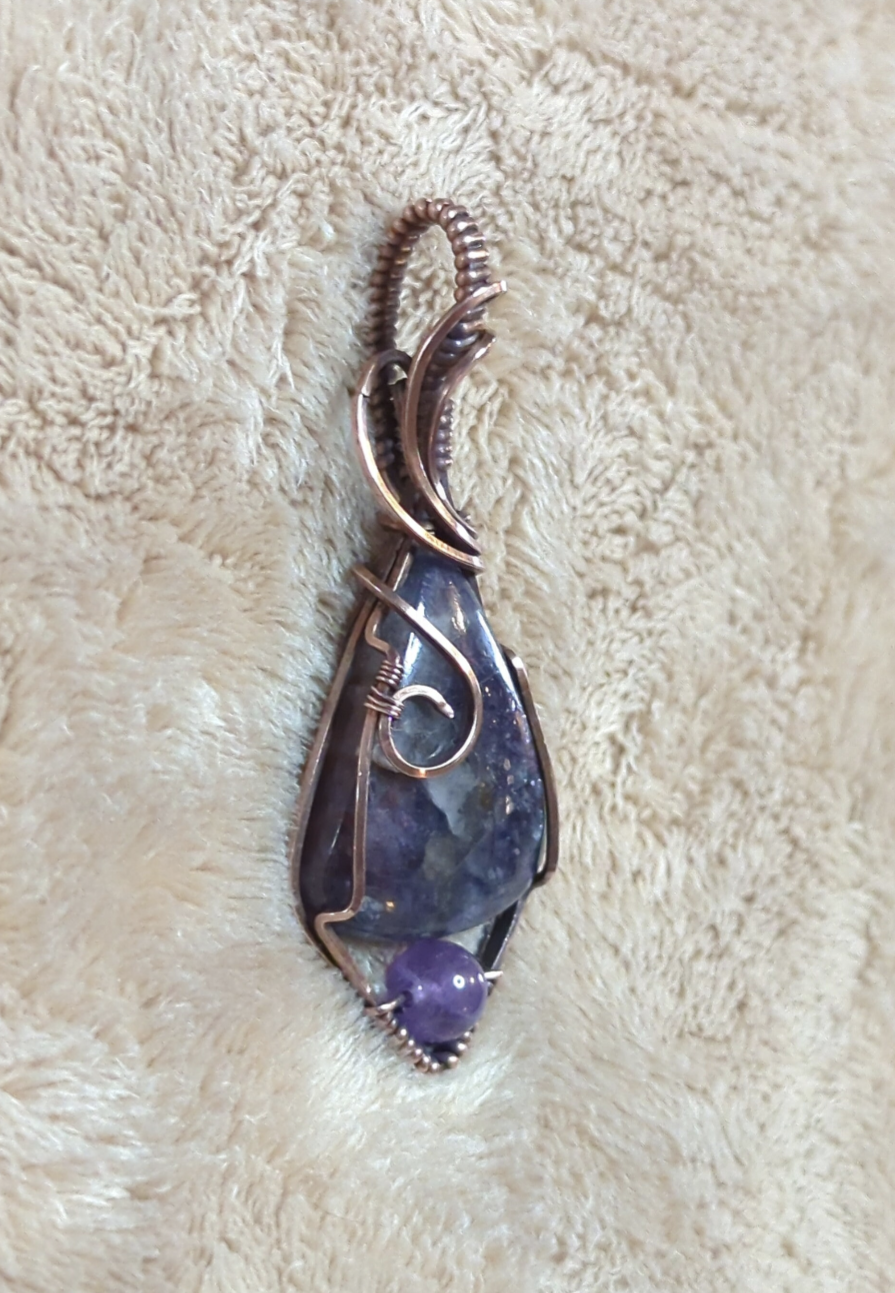 Iolite sunstone pendant, accented with Amethyst, set in antiqued copper.