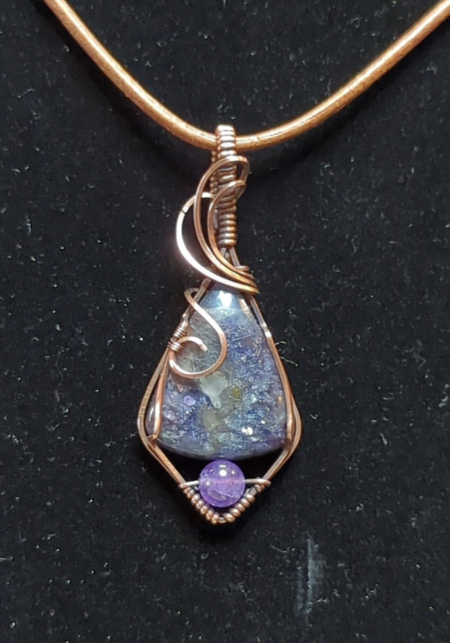 Iolite sunstone pendant, accented with Amethyst, set in antiqued copper.