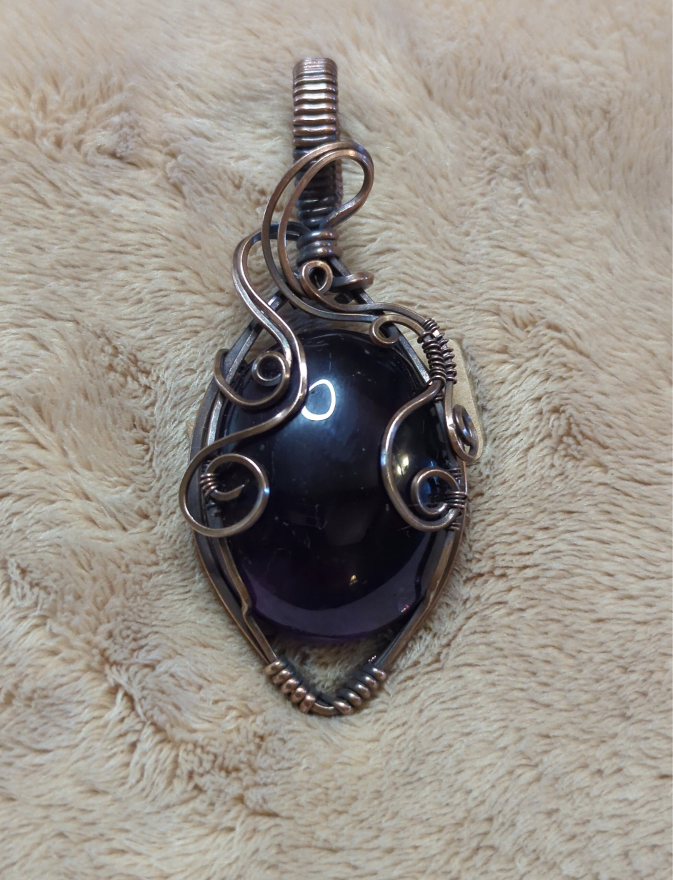 Amethyst pendant, set in antiqued copper.