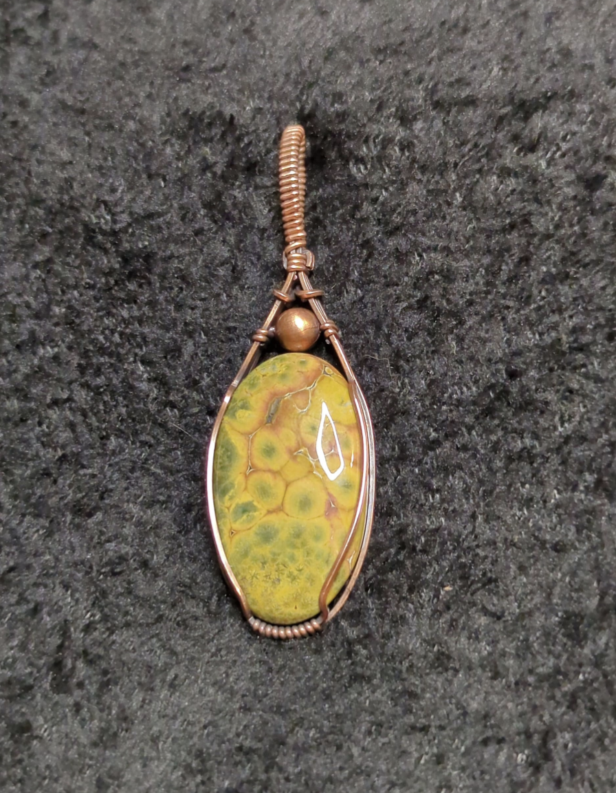 Ocean Jasper Pendant, accented with a copper bead, set in antiqued copper.