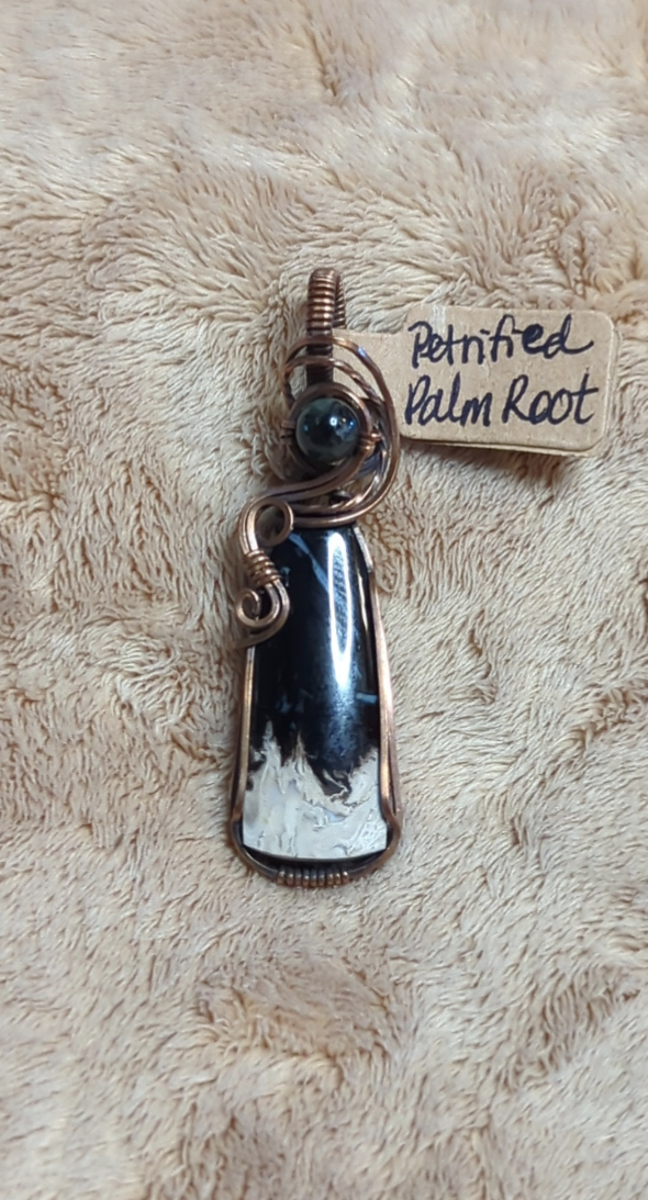 Petrified Palm root Pendant, set in antiqued copper. Accented with  black Tourmaline.