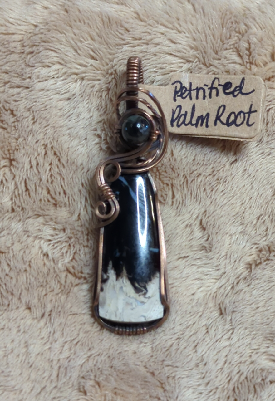 Petrified Palm root Pendant, set in antiqued copper. Accented with  black Tourmaline.