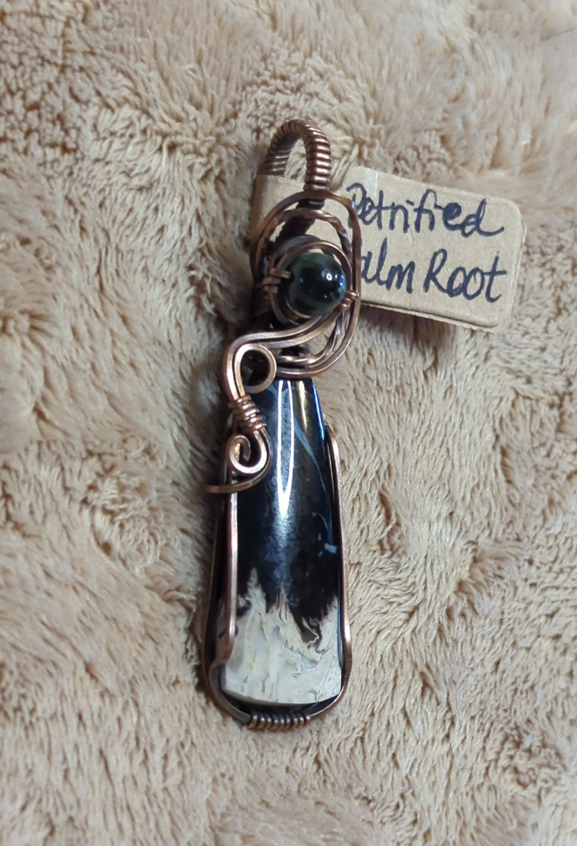 Petrified Palm root Pendant, set in antiqued copper. Accented with  black Tourmaline.