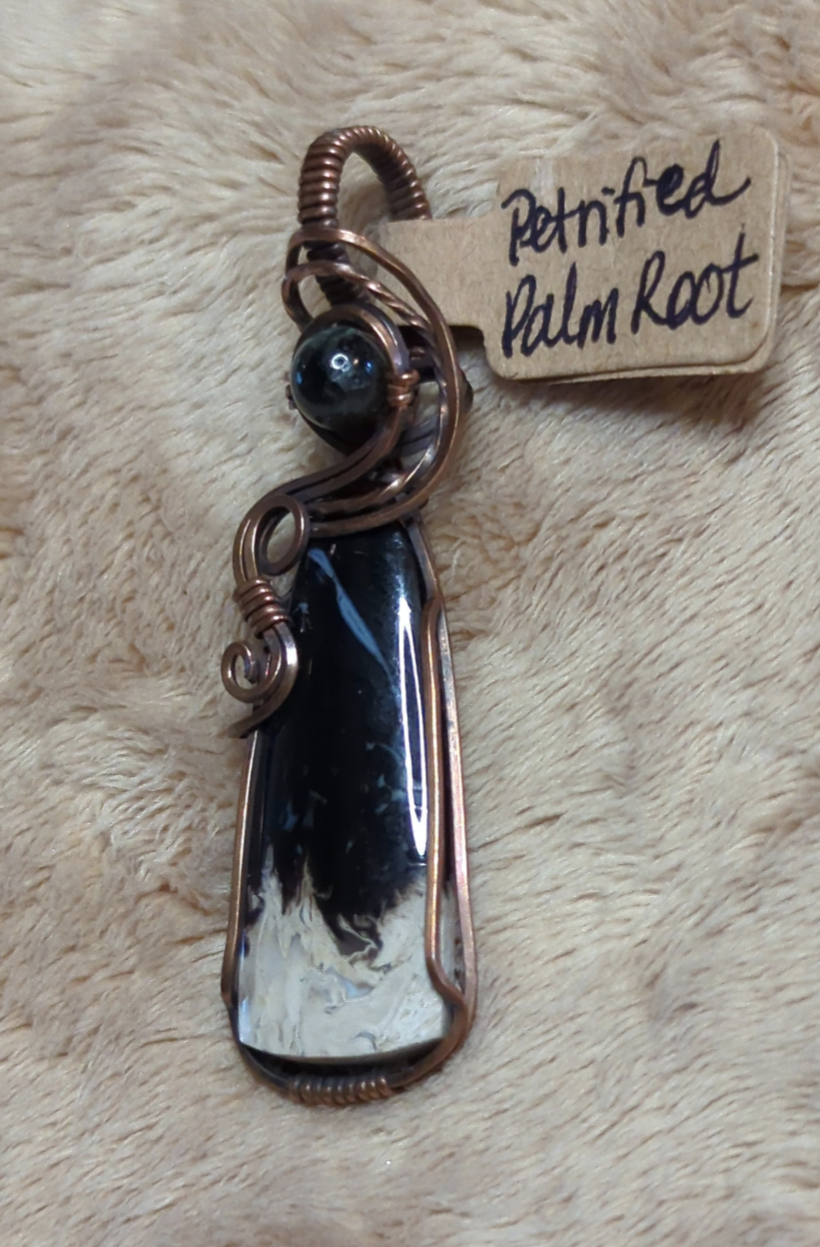 Petrified Palm root Pendant, set in antiqued copper. Accented with  black Tourmaline.