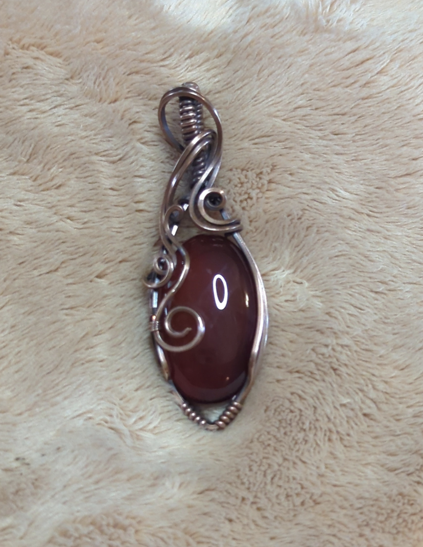 Red Onyx Pendant. Set in antiqued copper