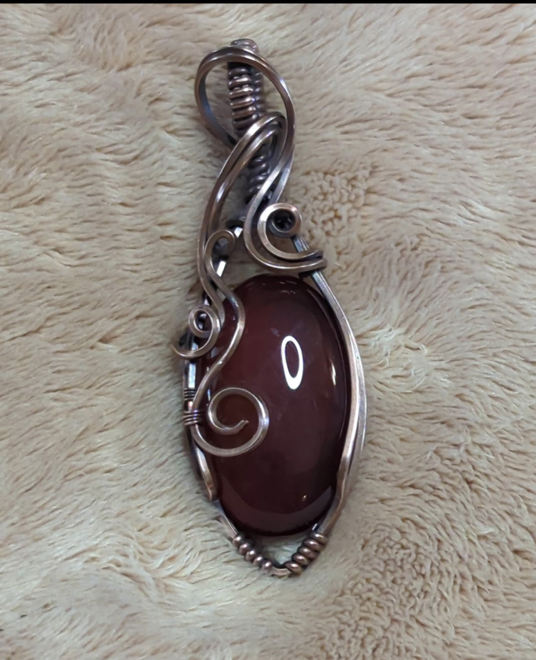 Red Onyx Pendant. Set in antiqued copper