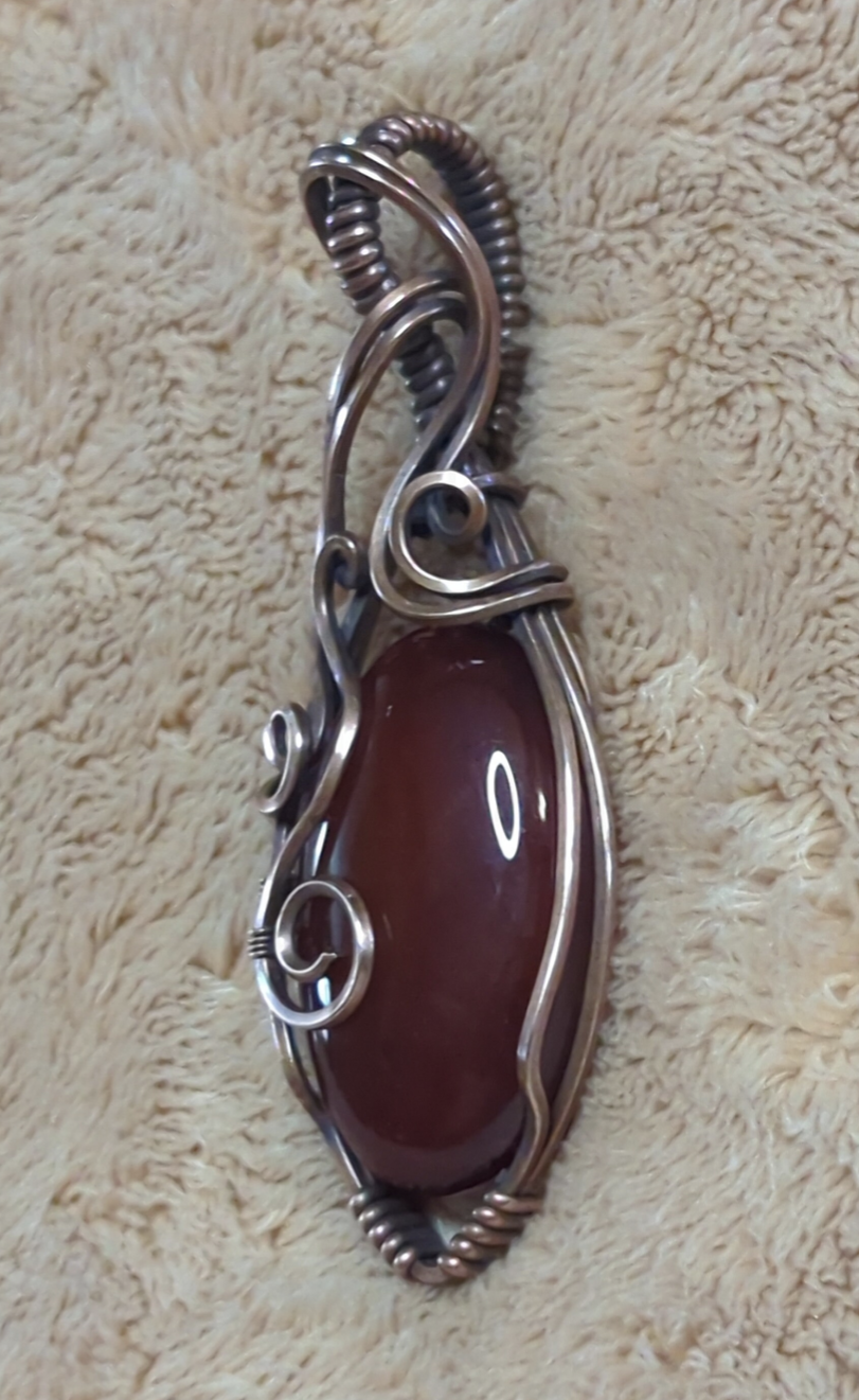 Red Onyx Pendant. Set in antiqued copper