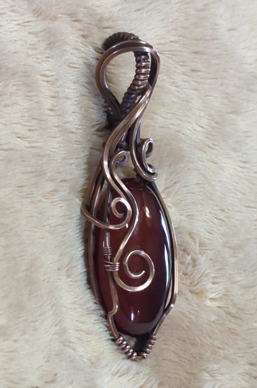 Red Onyx Pendant. Set in antiqued copper