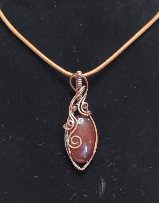 Red Onyx Pendant. Set in antiqued copper