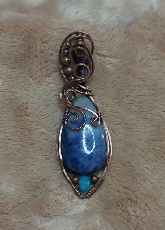 Sodalite Pendant, set in antiqued copper. Accented with a light blue Swarovski and copper beads.