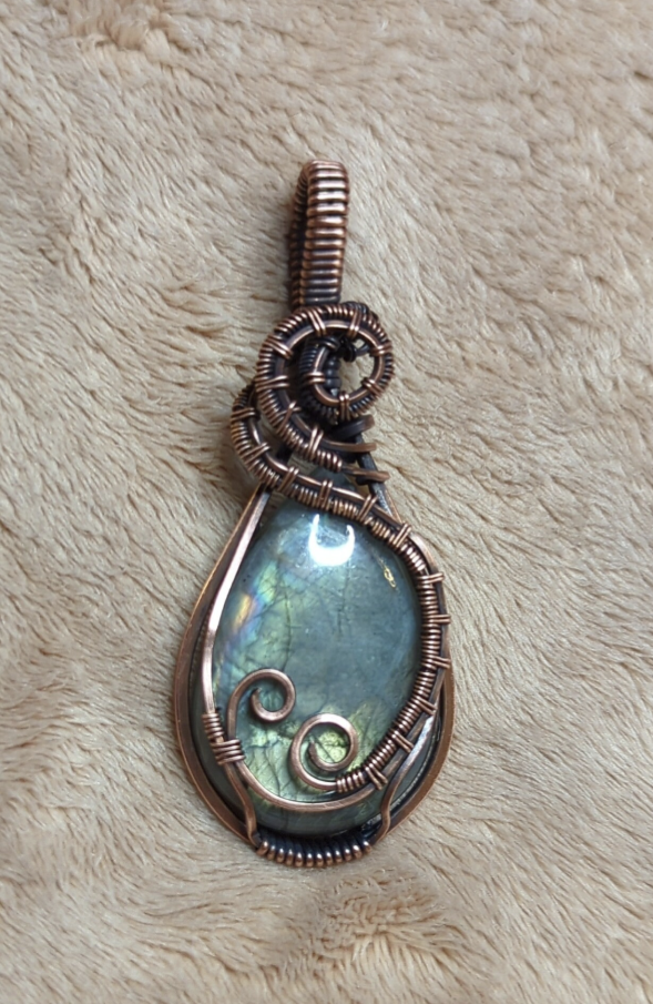 Labradorite gemstone pendant with blue and green flash, set in antiqued copper.