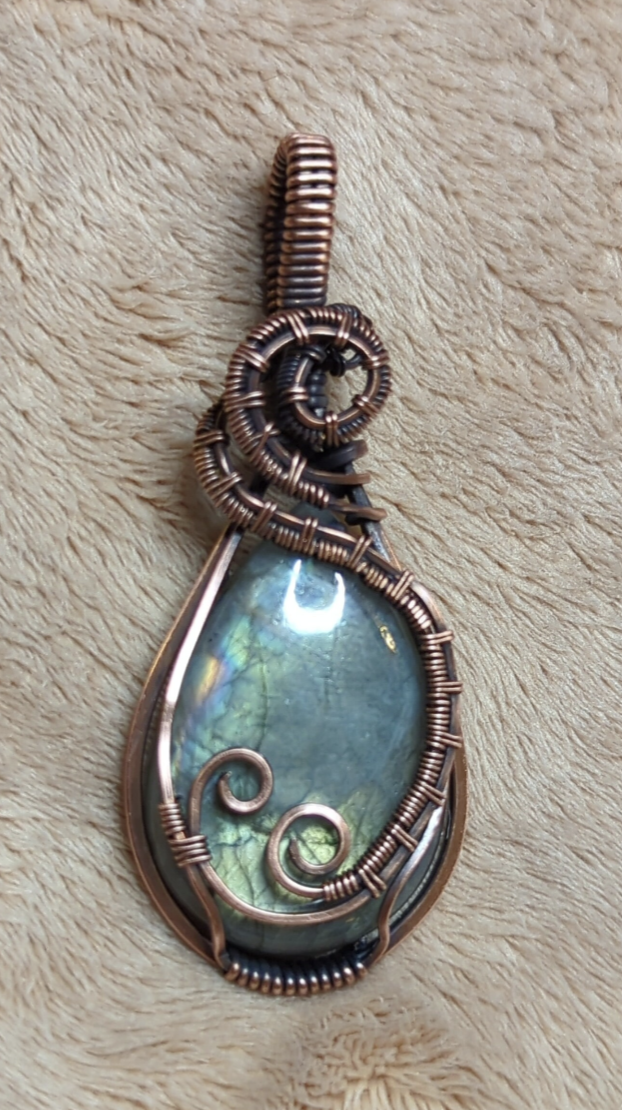 Labradorite gemstone pendant with blue and green flash, set in antiqued copper.