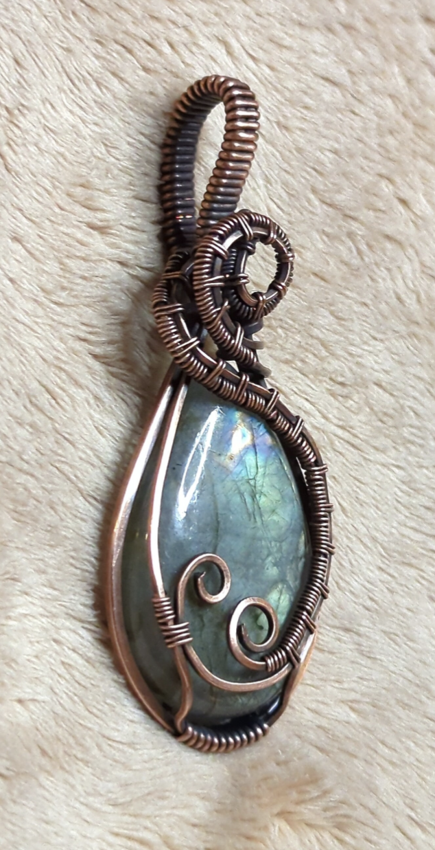 Labradorite gemstone pendant with blue and green flash, set in antiqued copper.