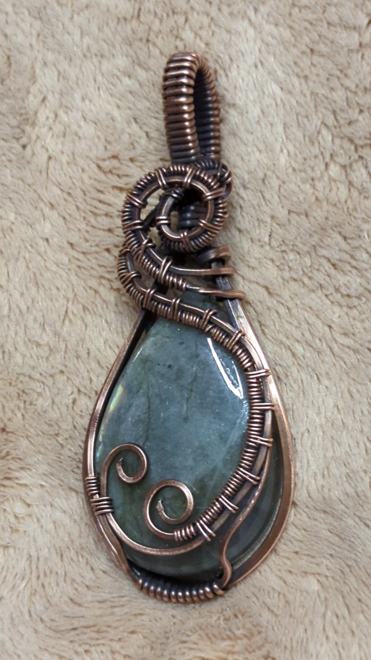 Labradorite gemstone pendant with blue and green flash, set in antiqued copper.