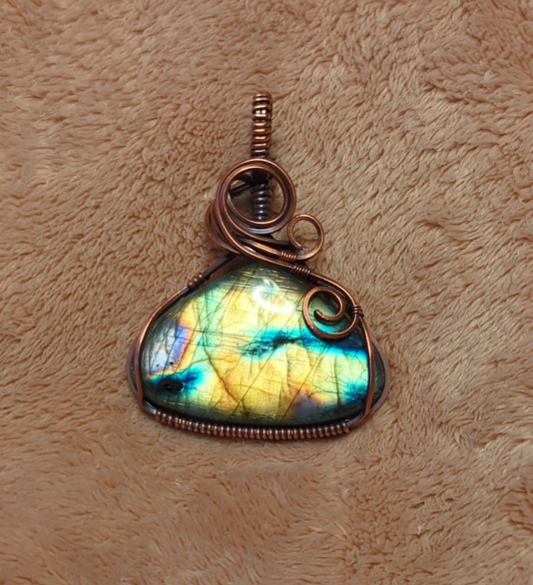 Labradorite gemstone pendant, with purple, green and blue flash, set in antiqued copper.