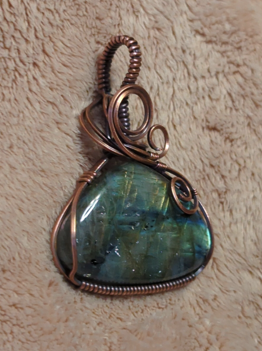 Labradorite gemstone pendant, with purple, green and blue flash, set in antiqued copper.